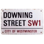 City of Westminster Downing Street sign in black and red lettering on white enamel background
