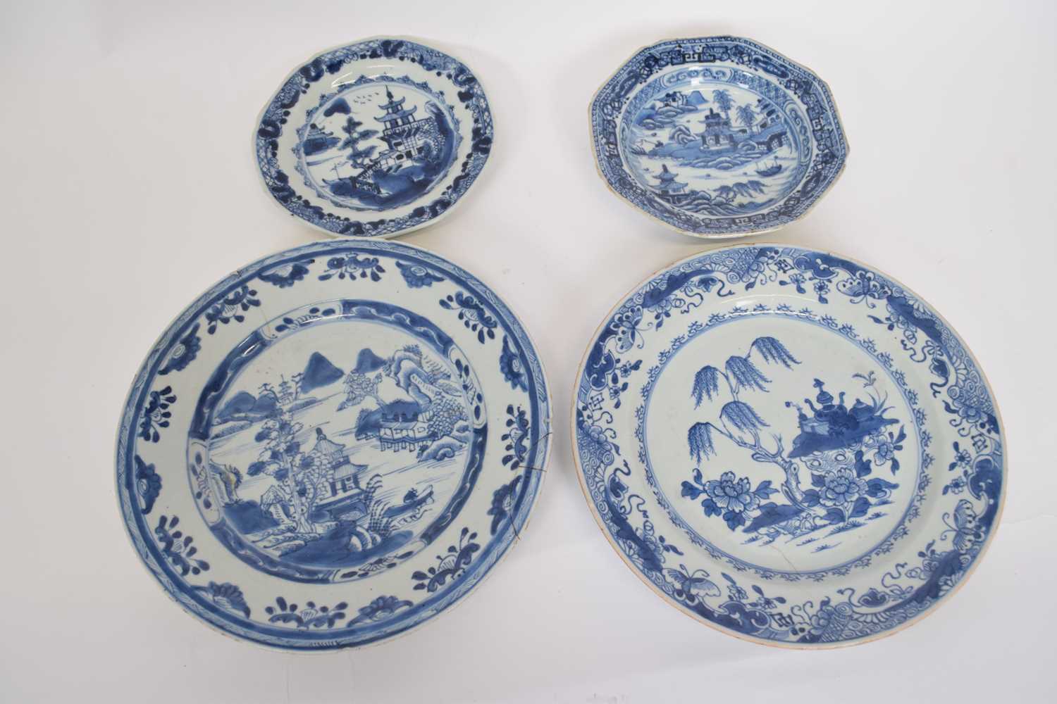 Two octagonal 18th century Qianlong plates, blue and white Nanking design, together with two further