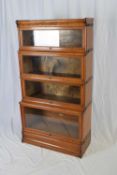 Globe Wernicke, a four tier oak stacking bookcase, 159cm high