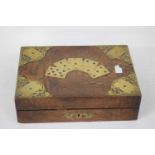 19th century brass bound and figured hardwood games box of hinged rectangular form, the interior