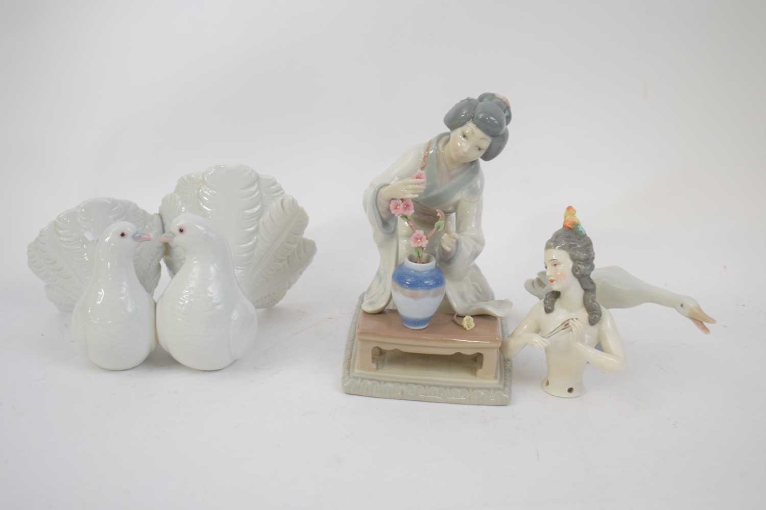 Pair of Lladro doves, also Lladro figure of a Japanese girl arranging flowers