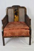 Late 19th/early 20th century chinoiserie decorated Bergere chair with red upholstered seat, 85cm