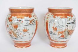 Pair of Japanese Meiji period Satsuma vases decorated in typical fashion, 21cm high (2)