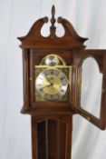 Reproduction grandmother clock in mahogany finish case with brass and silvered dial marked 'Tempus