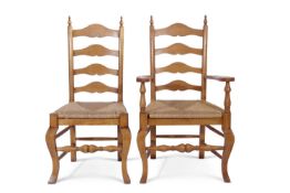 Set of eight reproduction oak ladderback and rush seated dining chairs with cabriole legs and turned
