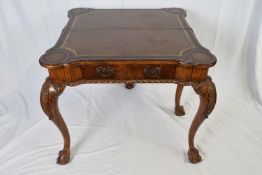 High quality reproduction walnut games table in the George II style, the folding top opening to a