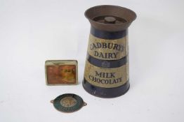 Early Cadbury Dairy Milk tin modelled as a milk churn and money box, together with a further small