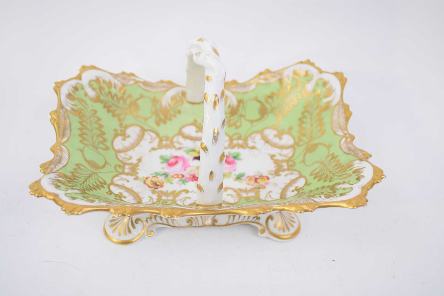 Late 19th century English porcelain basket, the green ground with floral design to the