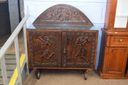 20th century West African hardwood sideboard, profusely carved with figures, hunting scene, and