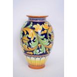 Italian Majolica vase decorated in typical colours, 33cm high