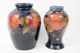 Moorcroft baluster vase in pomegranate pattern together with a further vase (a/f) (2)