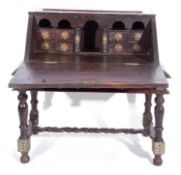 Large 19th century Ceylonese trunk on stand, top section with fall down front containing 8 small