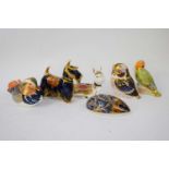 Collection of six Royal Crown Derby paperweights including an owl, a love bird signed by the artist,