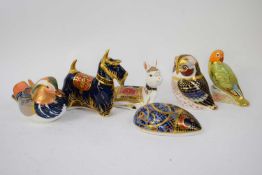 Collection of six Royal Crown Derby paperweights including an owl, a love bird signed by the artist,