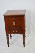 19th century mahogany pot cupboard with drop down door and single drawer to base, raised on turned