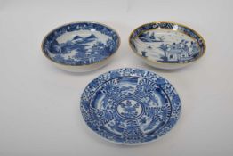 Group of three 18th century Qianlong period saucers with blue and white designs (3)