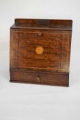 Early 20th century oak and inlaid smokers cabinet of wedge form with fitted interior and base