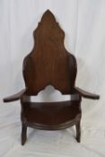 Jack Grimble of Cromer, an oak throne style chair with outswept arms, 110cm high