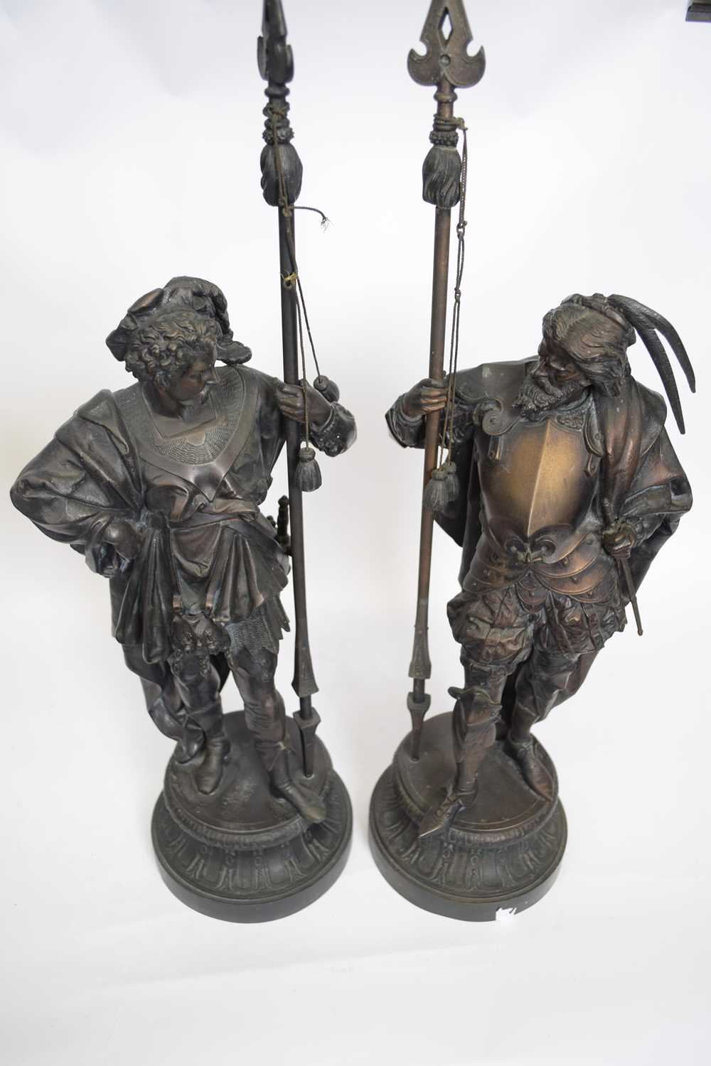 Pair of 19th century bronzed spelter models of lance wielding soldiers, raised on circular plinth - Image 2 of 3