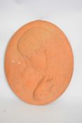 Terracotta plaque of young girl and child, oval shape, 38cm long