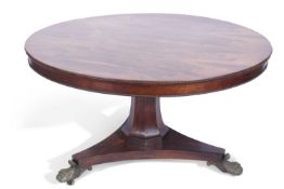 Regency rosewood dining table having a figured rosewood veneered top with beaded edges, between a