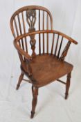 19th century yew wood, ash and elm Windsor chair with pierced splat back, curved arms, turned legs