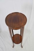 Edwardian mahogany and inlaid circular two tier plant stand raised on tapering legs, 95cm high