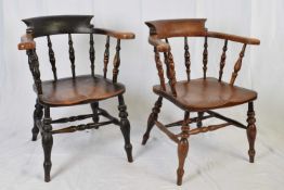 Two Victorian elm seated bow back smokers or captains chairs, raised on turned legs, 64cm wide