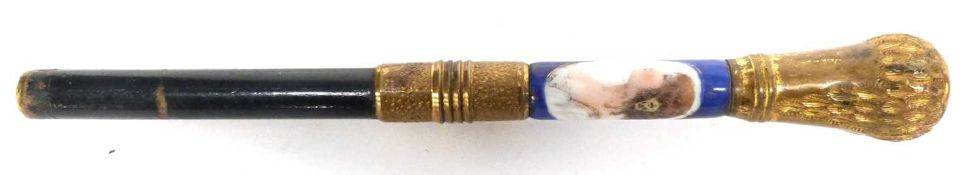 Wooden baton with gilt metal mounts, the blue porcelain ground with figure of a young girl