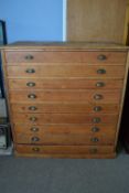Early 20th century stained pine architects plan or map chest with nine long drawers with brass cup
