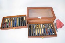 Wooden cased collection of pens