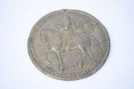 Brass plaque with model of Oliver Cromwell on horseback with Latin inscription to border