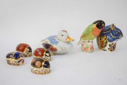 Quantity of Royal Crown Derby paperweights, one black faced love bird signed by Sue Rowe, also a