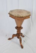 Victorian faded walnut trumpet sewing table, the octagonal hinged top with inlaid chequerboard
