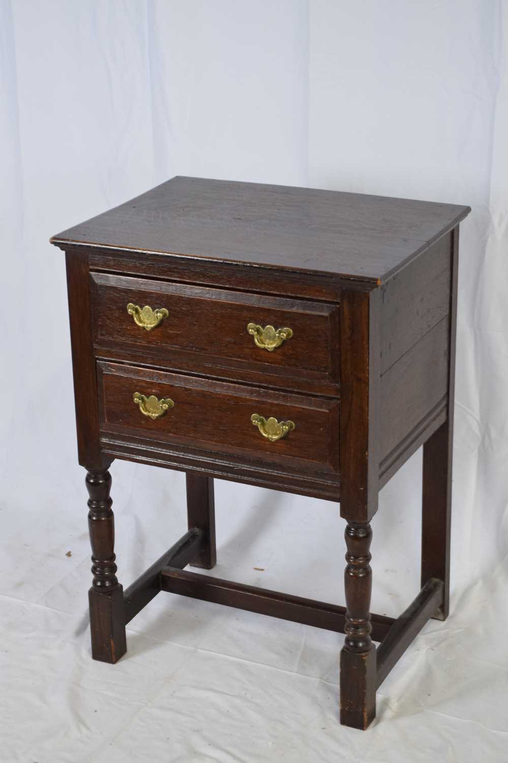 18th century style oak two-drawer side cabinet raised on turned legs, 56cm wide