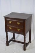 18th century style oak two-drawer side cabinet raised on turned legs, 56cm wide