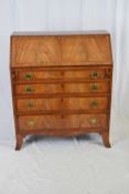 19th century flame mahogany veneered bureau with fall front opening to a fitted interior over a base