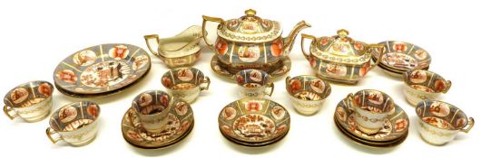 Early 19th century English porcelain tea set in an Imari design comprising tea pot and stand, milk