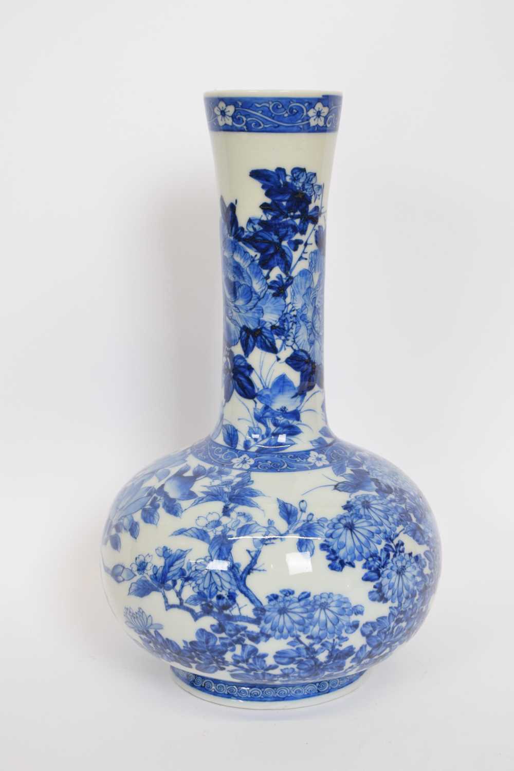 Japanese porcelain vase with blue and white floral design, 32cm high