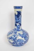 Japanese porcelain vase with blue and white floral design, 32cm high