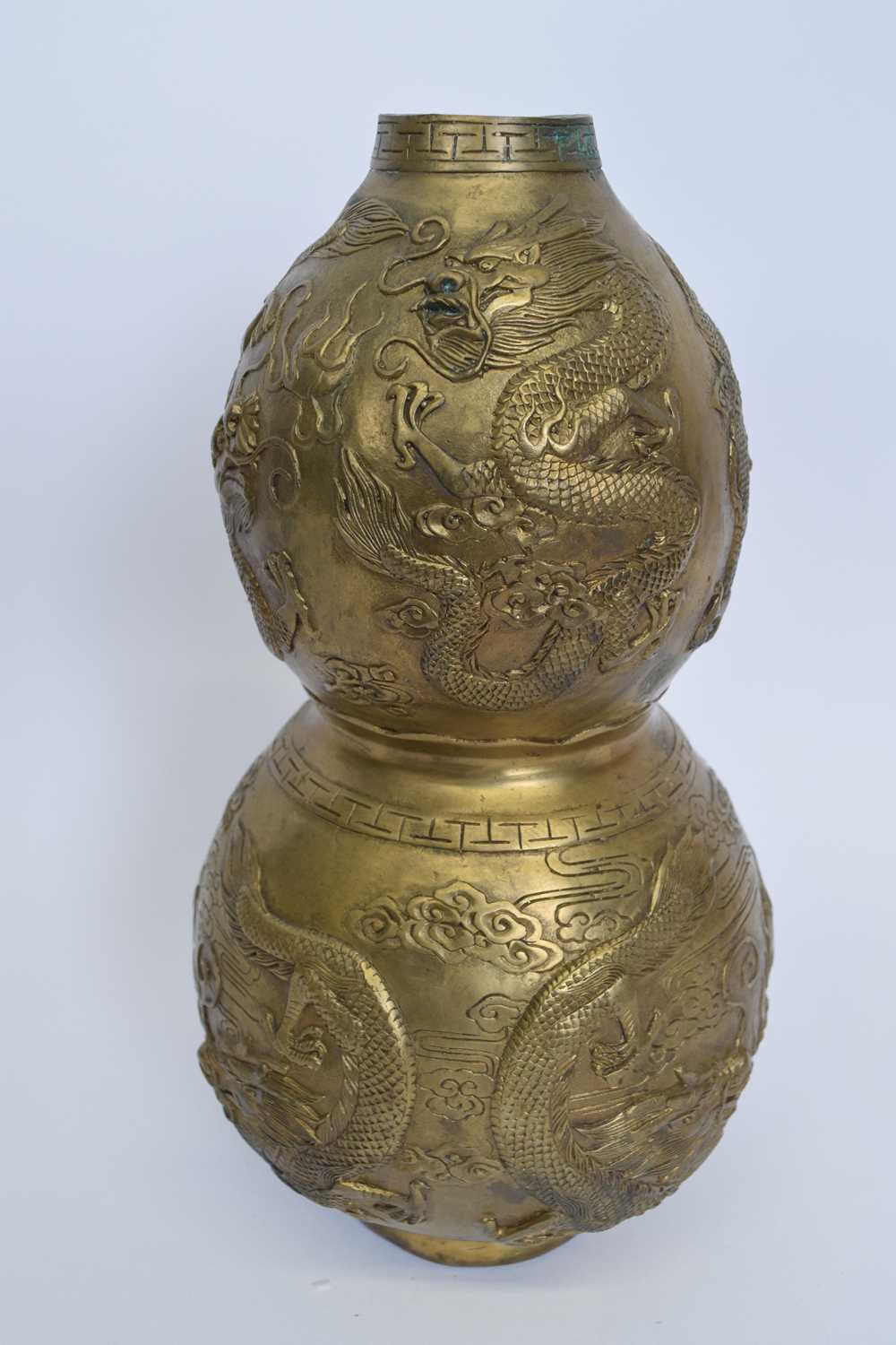 Chinese metal ware bronzed effect double gourd vase decorated with dragons chasing the flaming - Image 2 of 4
