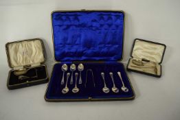 Two cased sets of silver spoons