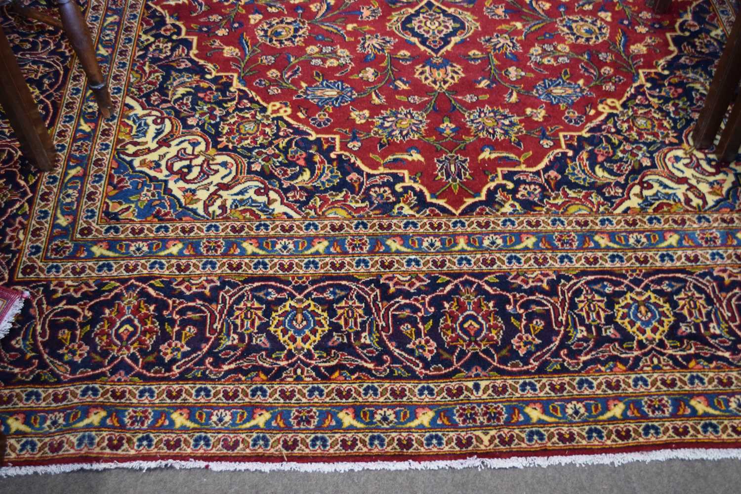Large Kashan wool floor rug decorated with a large central red and blue panel surrounded by a floral - Image 3 of 3