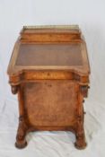 Victorian walnut veneered Davenport desk of typical form fitted with a brass gallery over a body