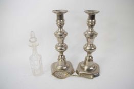 Pair of silver plated candlesticks, plated berry spoon and small glass jar and stopper