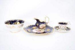 Quantity of English porcelain tea wares decorated in Coalport style, the blue ground with floral