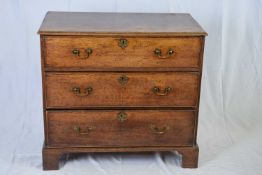 George III oak chest of three drawers with brass swan neck handles, raised on bracket feet, 94cm
