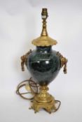Gilt brass table lamp with onyx decoration, 50cm high