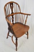 Ash, yew wood and elm Windsor chair with hooped back, saddle seat and turned front legs with