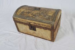 Small 18th/19th century dome top trunk covered in pony skin with metal studded detail, hinged lid